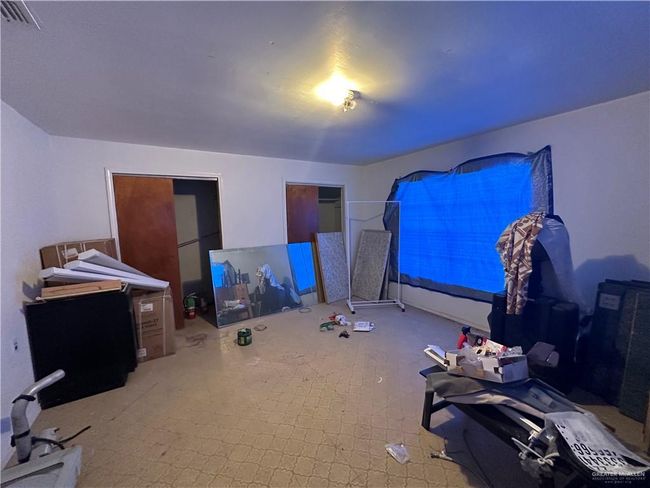 Bedroom with carpet flooring | Image 12
