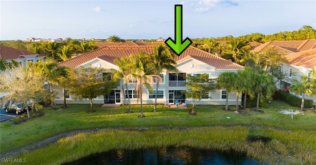 Back of unit featuring a water view and a landscaped area | Image 27