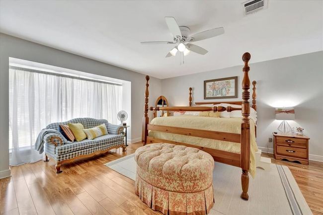 Another view of the primary bedroom. All of the bedrooms are carpet free offering beautiful wood like flooring. You will also appreciate that there is NO popcorn ceilings!! | Image 31
