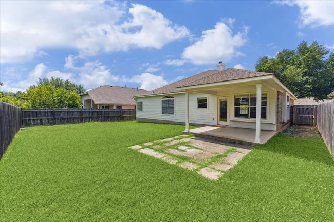 Back of the home with a fully fenced backyard | Image 29