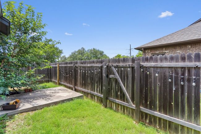 Fenced backyard featuring a patio area | Image 27