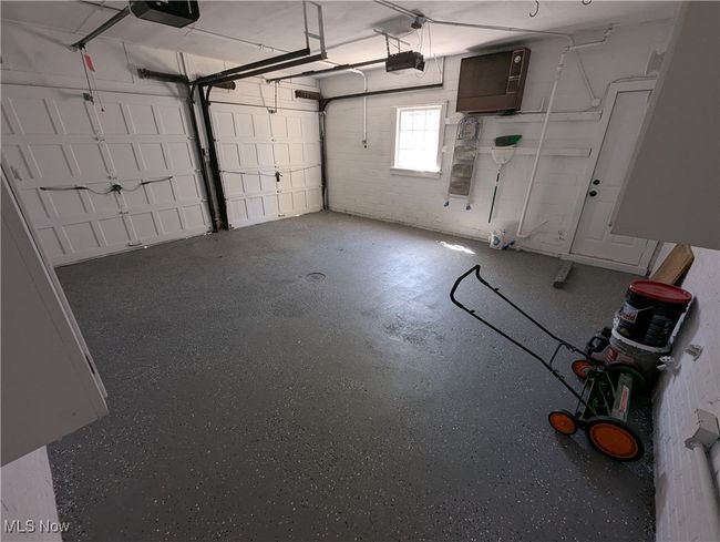 Garage featuring a garage door opener | Image 30