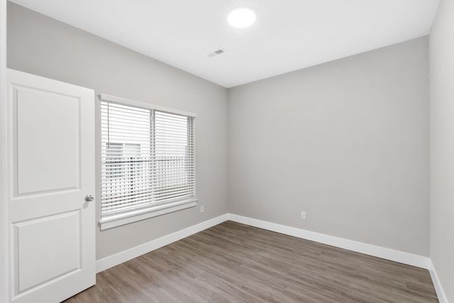 Empty room with wood finished floors and baseboards | Image 24
