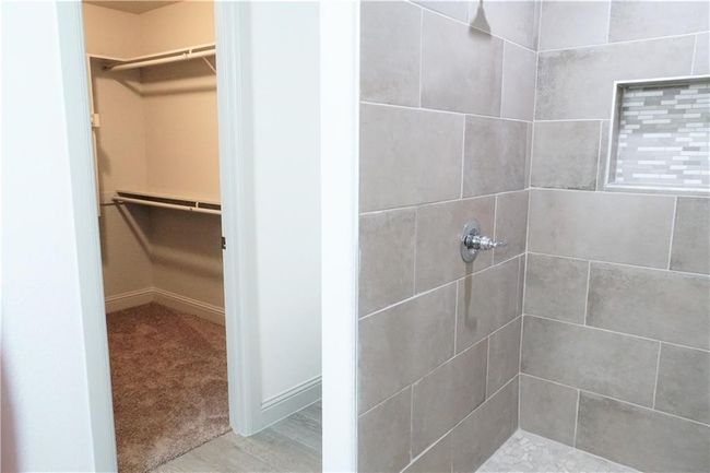 Full bath with a tile shower and a walk in closet | Image 15