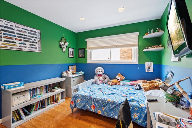 Bedroom featuring wood finished floors and recessed lighting | Image 12