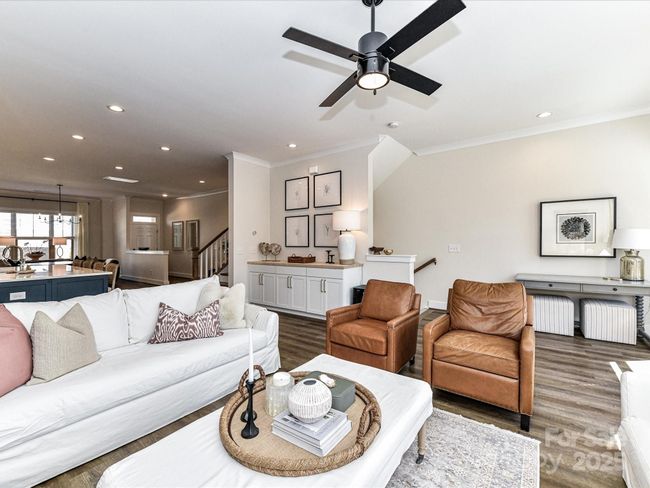 Great Room with nice natural light, beautiful finishes, moldings & custom built ins! | Image 15