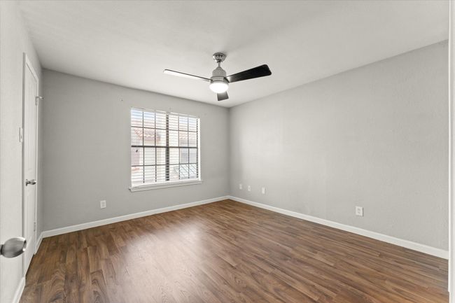 Empty room featuring dark wood finished floors and ceiling fan | Image 23