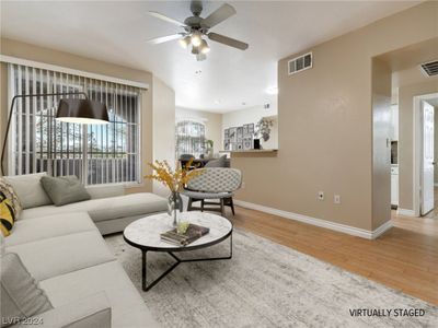 Virtually staged living / dining room. | Image 3