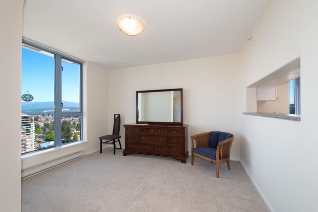 Sitting room featuring carpet flooring, baseboards, and baseboard heating | Image 16