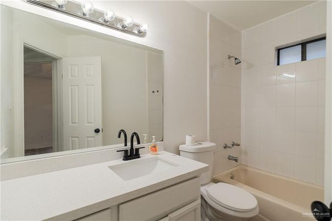 Full bath with tub / shower combination, vanity, and toilet | Image 9