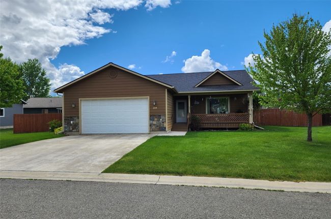 Single story home featuring an attached garage, driveway, covered porch, and roof with shingles | Image 47