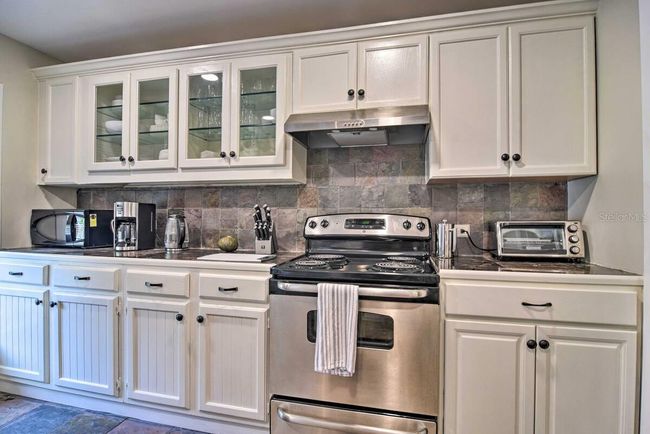 Kitchen with upper original cabinets | Image 5