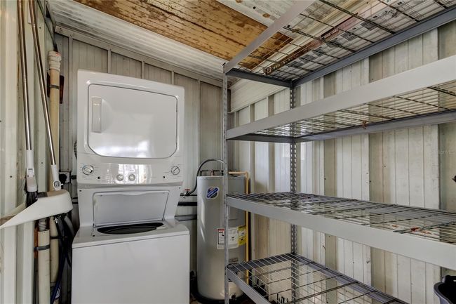 11. Newer Shed on Lanai Provides Nice Laundry Room w Newer Stackable Washer & Dryer (Included!).. Lots of Storage Space too! | Image 11