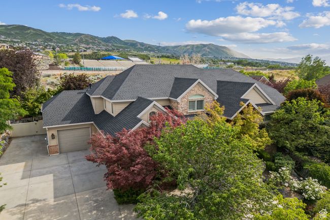 Aerial view of property and surrounding area with a mountainous background | Image 5