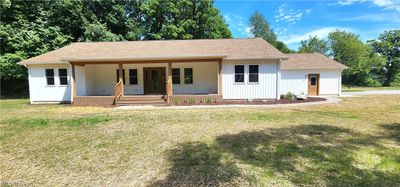 View of front of property withcovered porch and a front lawn | Image 2