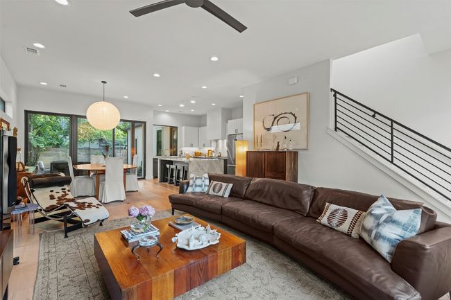 Living room featuring light wood finished floors, recessed lighting, and a ceiling fan | Image 9