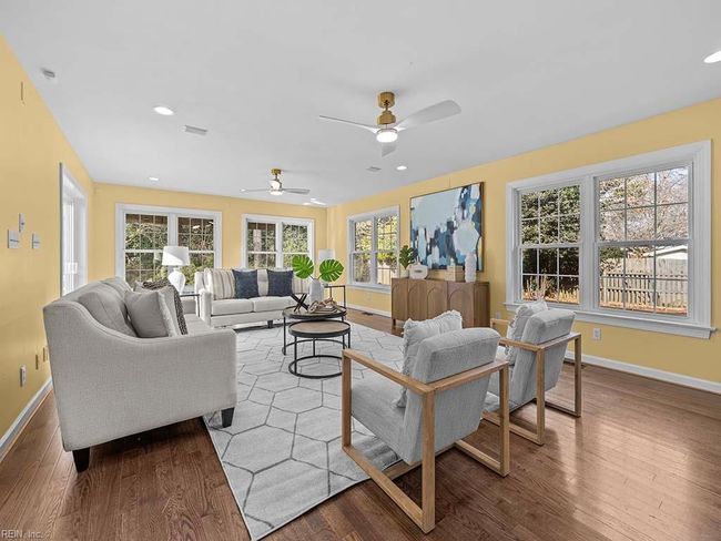 This open and sunny family room is a joy to relax & unwind in. | Image 22