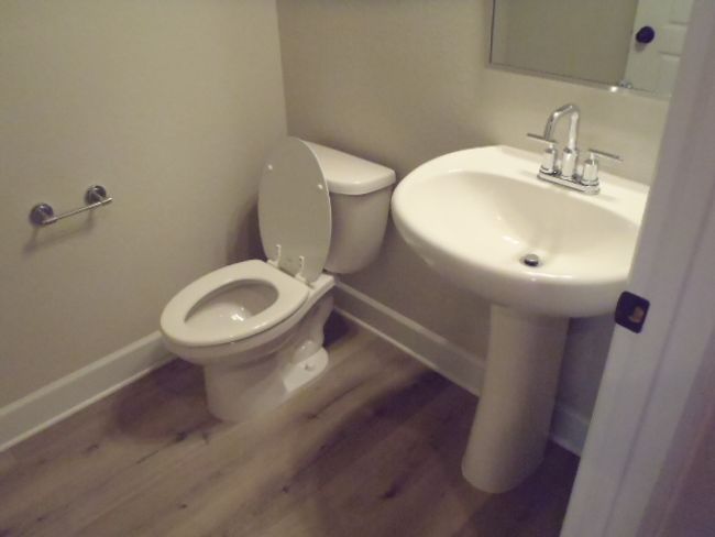 Half bath featuring baseboards and wood finished floors | Image 31