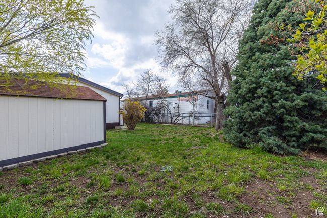 View of yard featuring an outdoor structure | Image 19