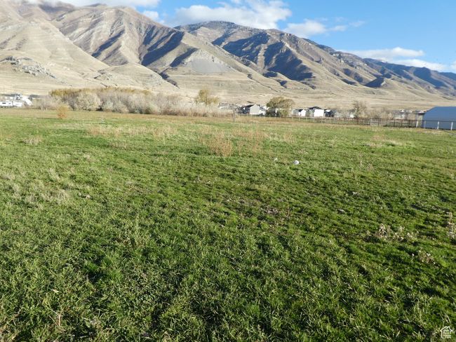 View of mountain backdrop with rural landscape | Image 10