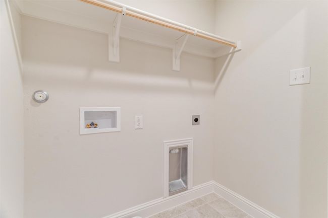 Laundry room featuring washer hookup and hookup for an electric dryer | Image 33