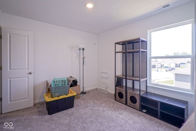 sitting room with carpet floors and baseboards | Image 28
