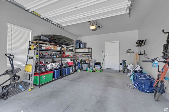 Garage featuring a garage door opener | Image 20