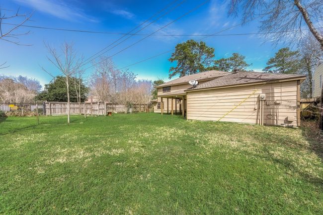 Expansive backyard space, perfect for any needs. | Image 39