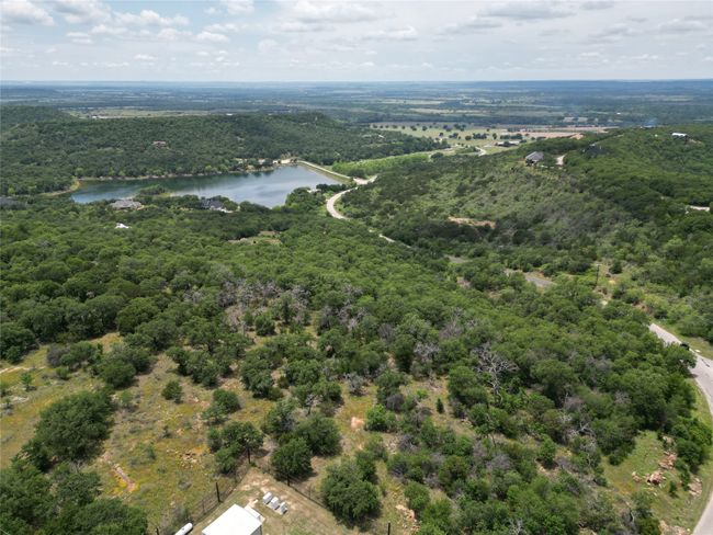 Birds eye view of property featuring a forest view and a water view | Image 12