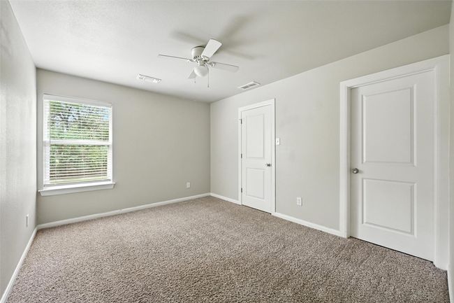 Unfurnished bedroom with carpet floors and ceiling fan | Image 10