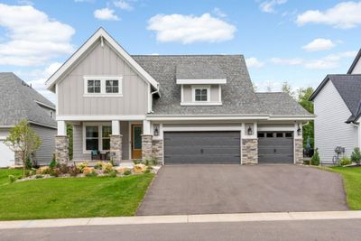 You will appreciate this three car garage that is heated, insulated, and wired for a future electric car charging station. There is also a 9' trench garage floor drain. | Image 2