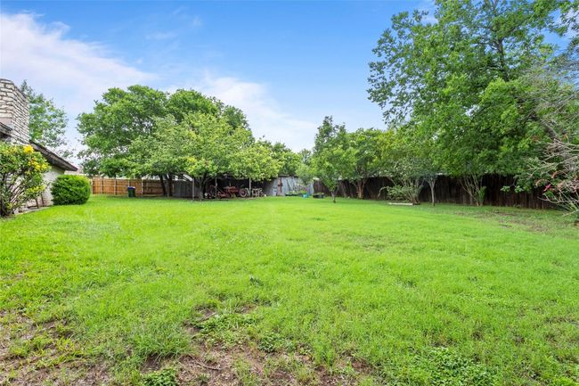 View of fenced backyard | Image 34