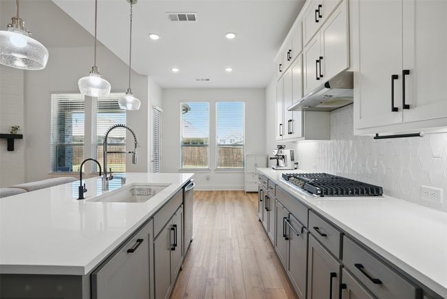 kitchen features trash can pull out | Image 4