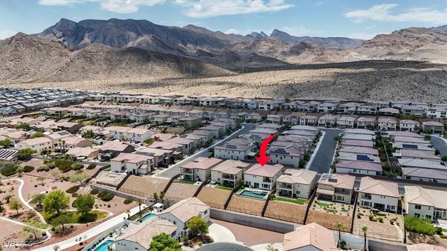 Aerial view of residential area featuring a mountain backdrop | Image 65