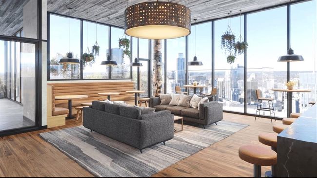 Community lobby featuring expansive windows, a city view, and a high ceiling | Image 26