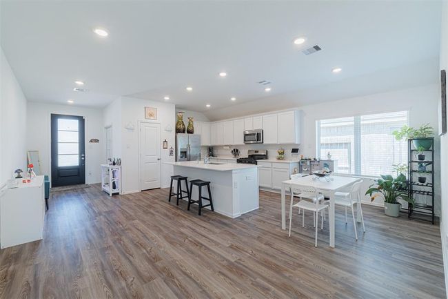 Another view of the kitchen from the family room. | Image 7
