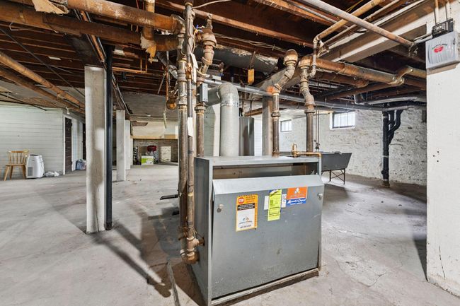 Shared boiler for the building. Remember that HEAT is included in the $425/month HOA dues (as well as water, building insurance, lawn mowing, snow removal, carpet cleaning (stairs/landings), water heater & boiler and building exterior. | Image 38
