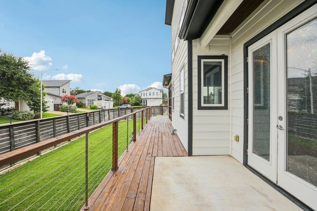 Wooden terrace with a residential view and a lawn | Image 39