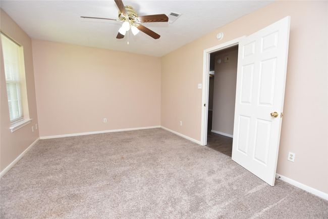 Neutral tones in this bedroom creates a serene environment, ready for personalization. | Image 20