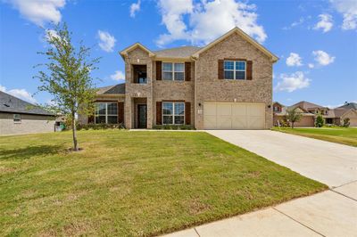 View of front of home with a garage and a front lawn | Image 2