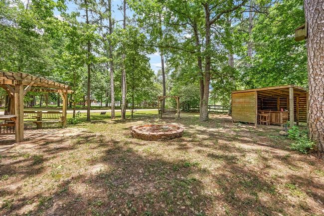 Enjoy your own personal park, this space is part of the property and is located to the right of the home. It includes multiple gazebos, benches, and a fire pit for late night smores! | Image 6