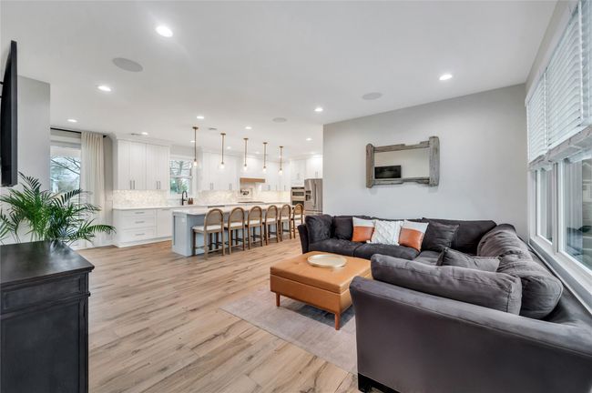 Living room with light wood-style flooring and recessed lighting | Image 6