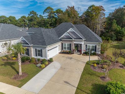 Craftsman house featuring a garage and a front lawn | Image 1