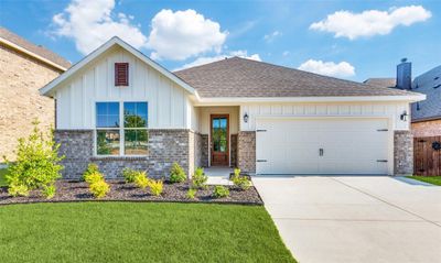 View of front of home with a garage and a front yard | Image 2