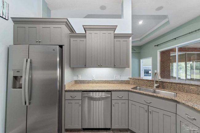 7008 Turnberry Cir, House other with 4 bedrooms, 2 bathrooms and 3 parking in Navarre FL | Image 30
