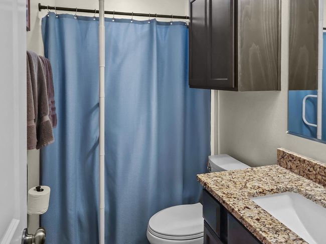 Full bath with vanity and a shower with curtain | Image 23