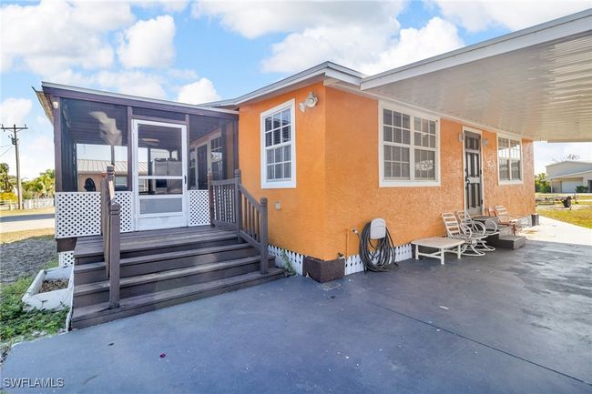 Rear view of property featuring a patio, , and stucco siding | Image 8