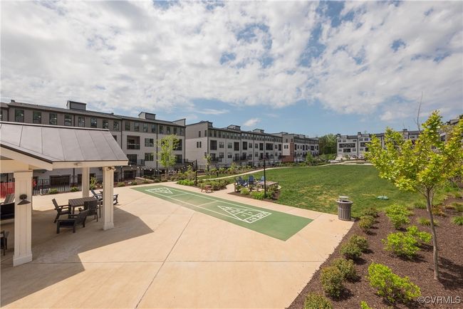 View of community with a yard and shuffleboard | Image 47