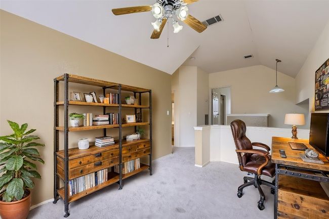 Office area with vaulted ceiling, a ceiling fan, and light colored carpet | Image 11