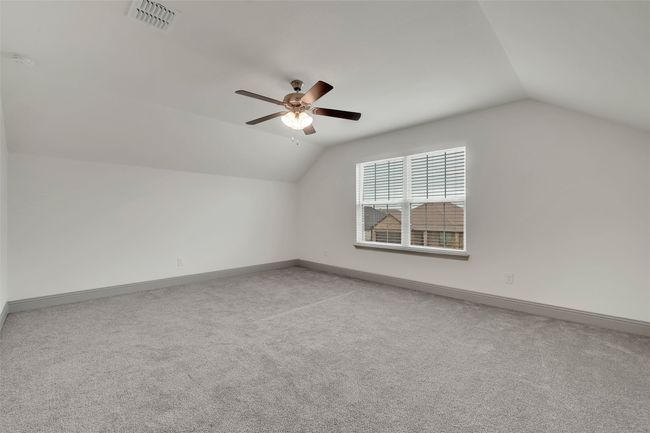 Bonus room with visible vents, baseboards, ceiling fan, vaulted ceiling, and carpet flooring | Image 26